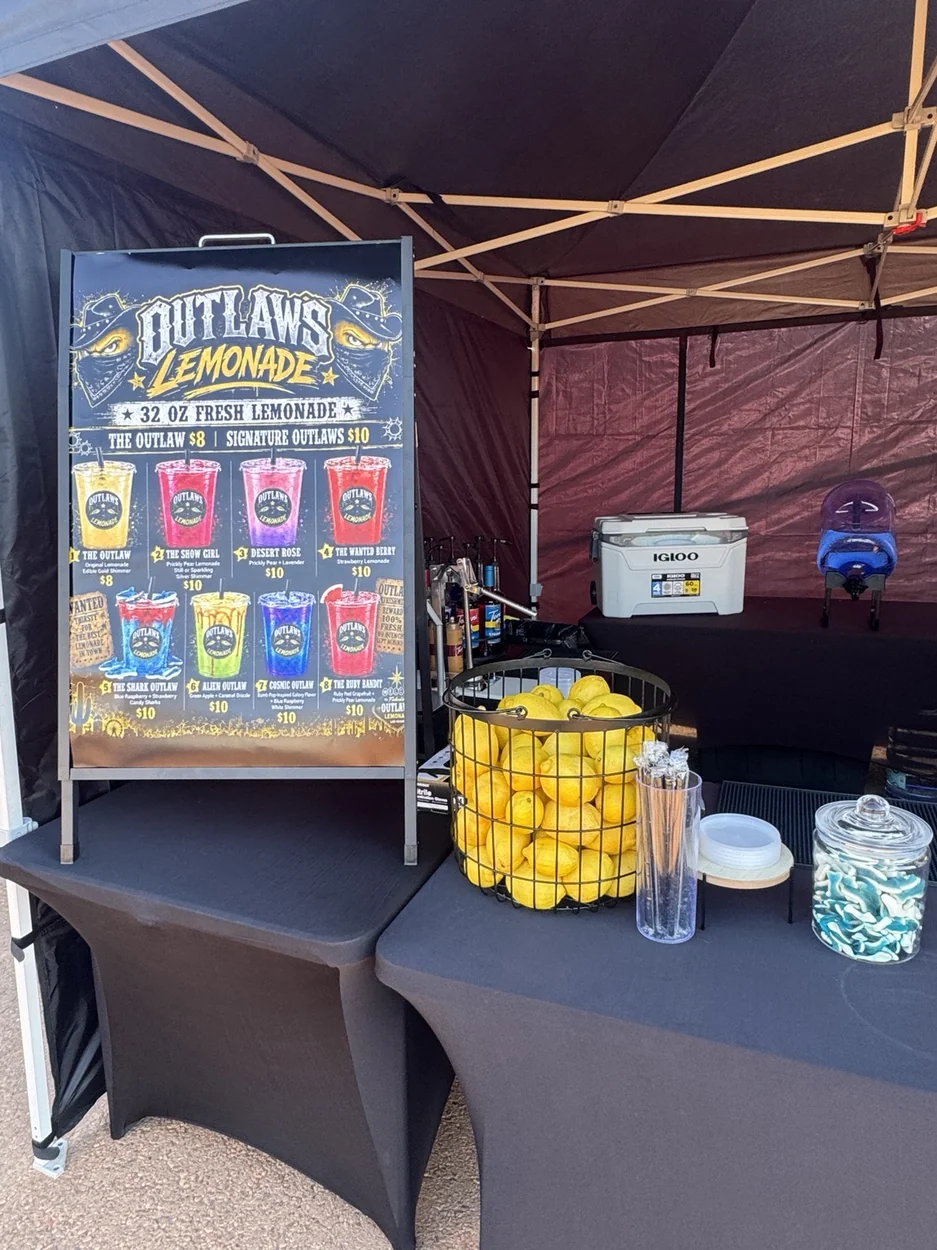 The branded Outlaws menu board on location